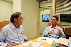 Production Meeting:  Joe discusses the upcoming shoot with guest Chris Palermo, President and CEO of Global Communications Networks, Inc.